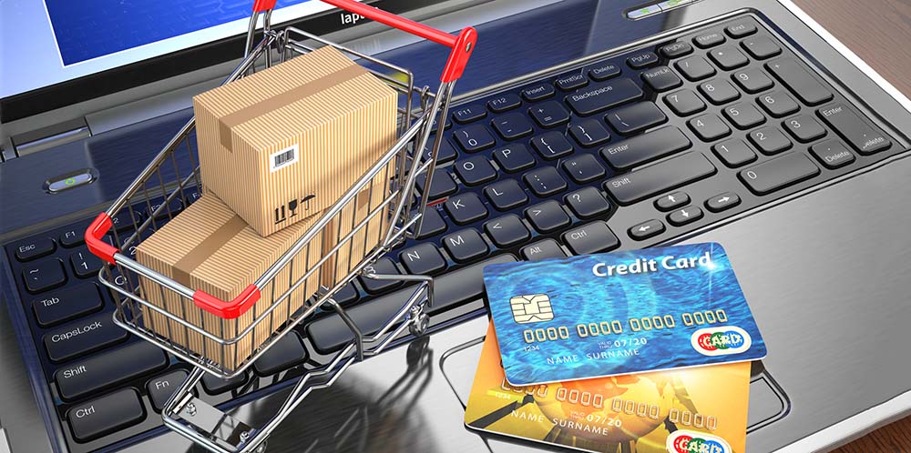 stockphotoscom-5610181 E-commerce. Shopping cart and credit cards on laptop Small